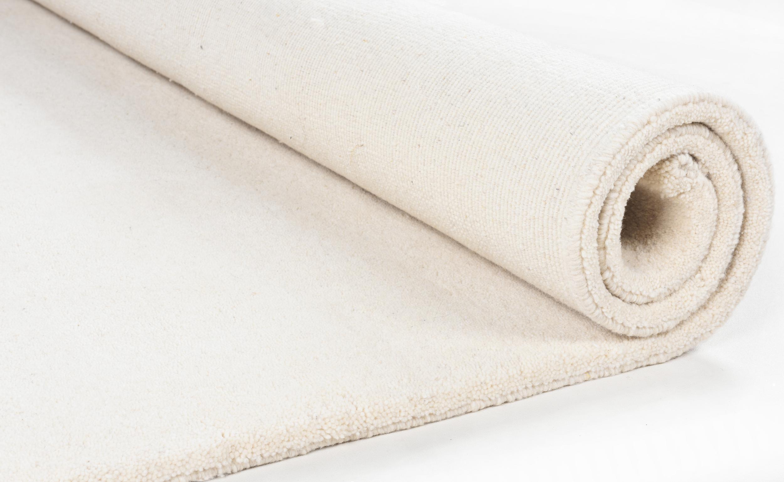 Wohnzimmer Teppich Maloronga Uni 997 Blanc aus 100% Schurwolle, in der Farbe Blanc | Homerugs - Detailsicht (4)